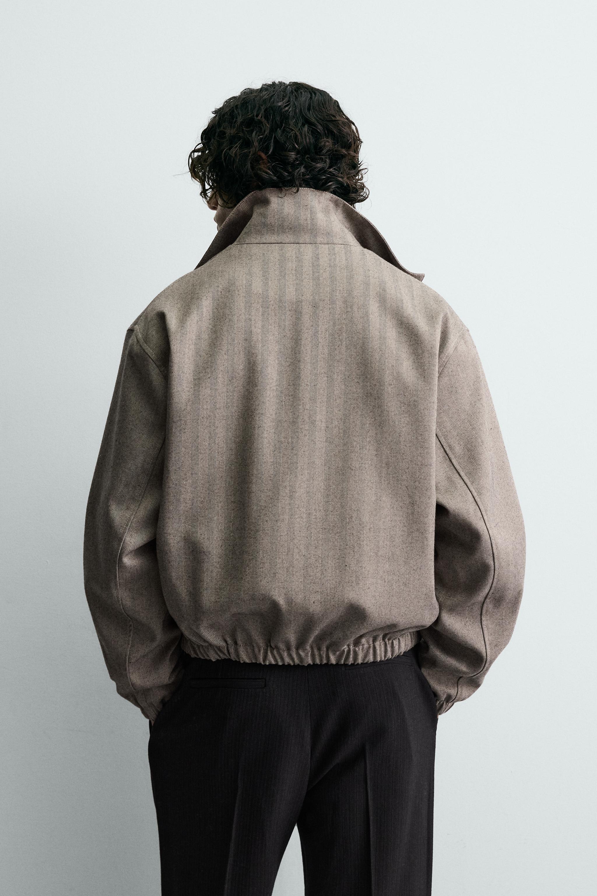 BLOUSON COURT COUPE STRUCTURÉE À CHEVRONS